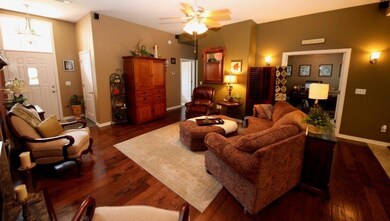 Beautiful hardwood floors and warm colors in the living room.