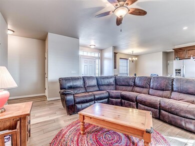 Living room with light wood-type flooring and ceil