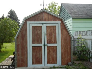 Storage Shed Behind The Garage.