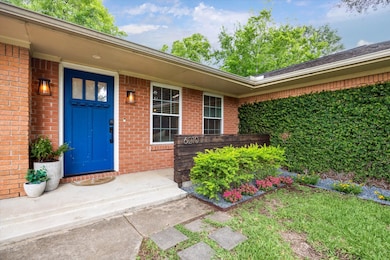 The front entrance, featuring a stylish blue door,