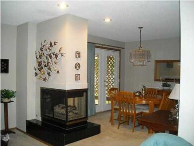 Two-way fireplace shared by living and dining area