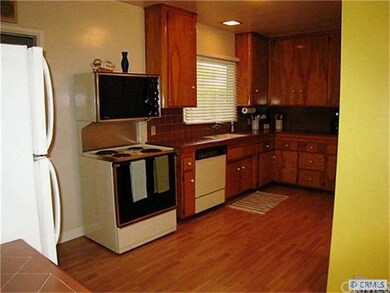 Nice sized kitchen with gleaming floors