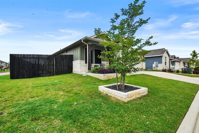 View of front facade featuring stone siding