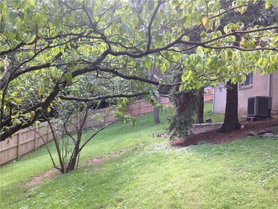 This newer, six foot stockade fence surrounds the