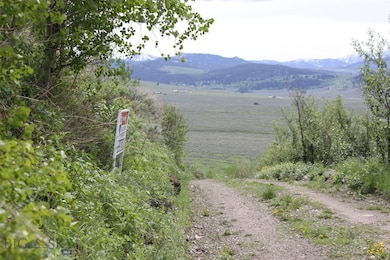 Property is located ABOVE the sign on this road.