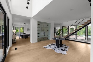 Entryway featuring light wood-style floors and stairs