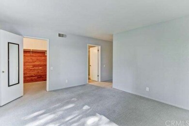 Walk--in, cedar-lined closet in master bedroom.