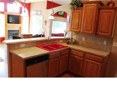 Large kitchen with true hard wood floors, stainles