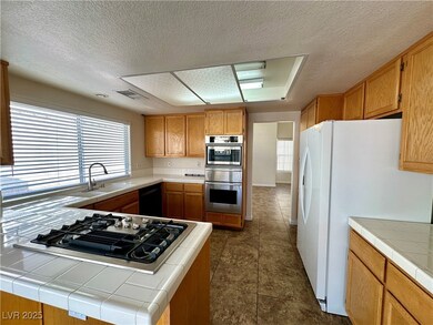 Kitchen with a sink, appliances with stainless ste