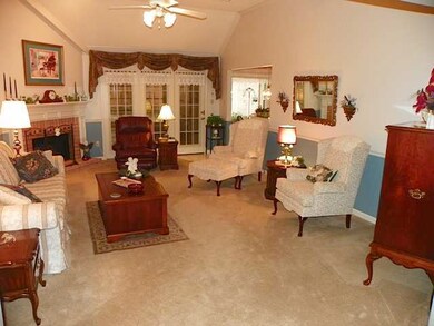 Inviting family room is 21` x 15` ... coffered cei