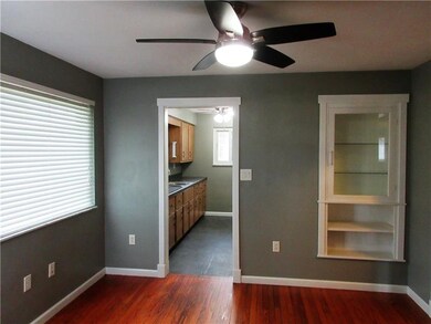 This dining area has a built in cabinet with shelv