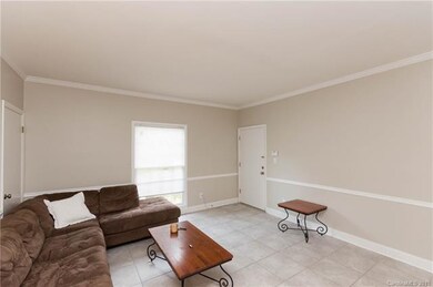 Walk Into An Open Floor Plan With Clean Tile Floor