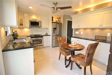 Custom cabinetry, ambient lighting, marble floors 