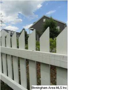 Charming picket fence surrounding the corner lot