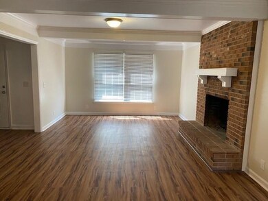 Living Area With Brick Fireplace