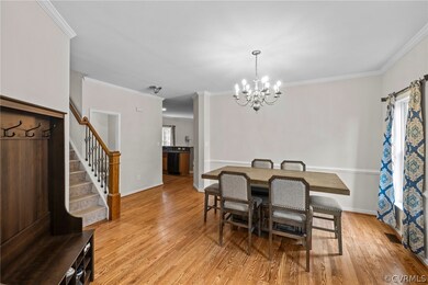 Dining room with a notable chandelier, ornamental