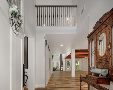 Beautiful engineered wood floors, custom trim work, neutral paint and lots of windows throughout