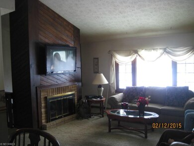 Main level Living room with wood burning fireplace