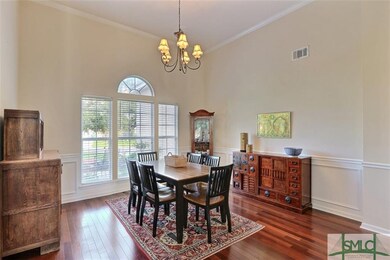 Spacious formal dining room with high ceilings, be