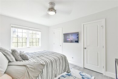 Bedroom featuring light hardwood / wood-style floo