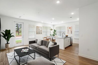 Living room with light hardwood / wood-style floor