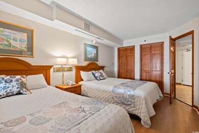 Bedroom with hardwood / wood-style flooring and a 