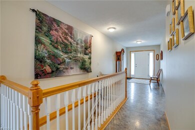 Front foyer & stairs to basement