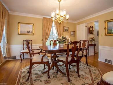 Formal Dining Room with Chandelier and Hardwood Fl