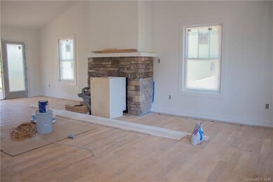 Living area w/ rock fireplace