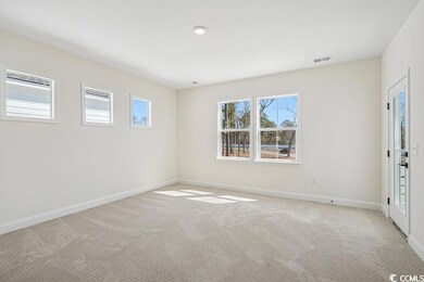 Empty room with visible vents, baseboards, and lig