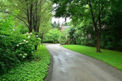 Elegant privacy shrubbery leads the way to the ent