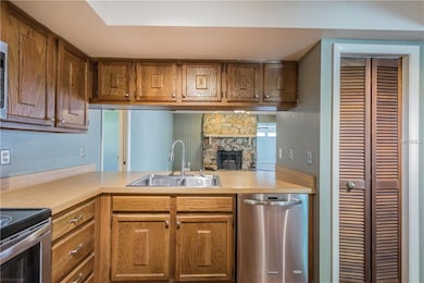 Kitchen overlooking the family room and cozy firep
