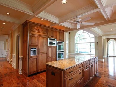 Kitchen. Custom beamed ceiling, hardwood flooring,