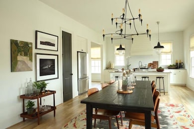 Dining space featuring a chandelier and light wood-style floors