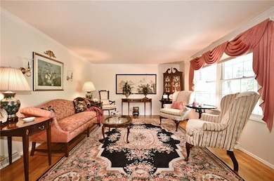 Formal living room shows off pretty hardwood floor