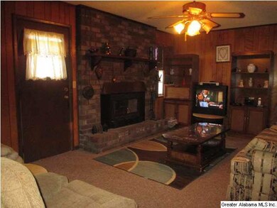Den adjoins the home-style kitchen