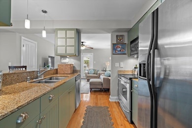 Kitchen with pendant lighting, sink, stainless ste