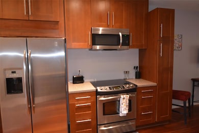 Kitchen featuring brown cabinets, appliances with