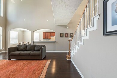Another view of the living space that invites you into the breakfast room and upgraded kitchen