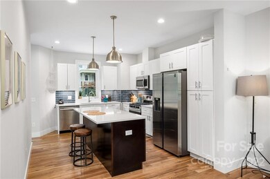 Gourmet Kitchen Features Quartz Countertops and Stainless Steel Appliances