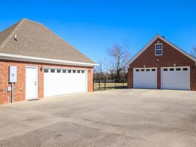 2 car attached plus oversized detached garage.