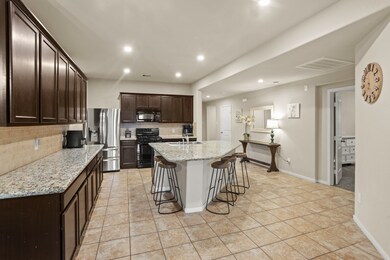 Rich wooden cabinets with tons of storage space, provide a clean and timeless look, enhancing the sense of brightness and openness in the space.