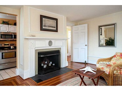 Living Room. Fireplace and peak of the kitchen. NB