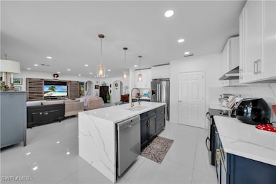 Kitchen featuring decorative backsplash, appliance