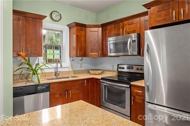 It's the perfectly configured kitchen for living. Additional cabinet space in the center island makes this kitchen work and play with expansive utility. Disposal installed.