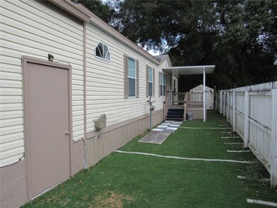 Fenced side yard with artificial turf grass