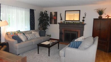 Living room with wood burning fireplace