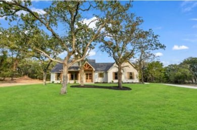 View of front of house featuring a front lawn