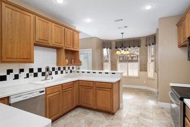 Kitchen features stainless steel appliances