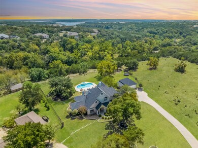 This stunning property is surrounded by majestic trees and backs up to a greenbelt providing PRIVACY and MAGNIFICENT HILL COUNTRY VIEWS.